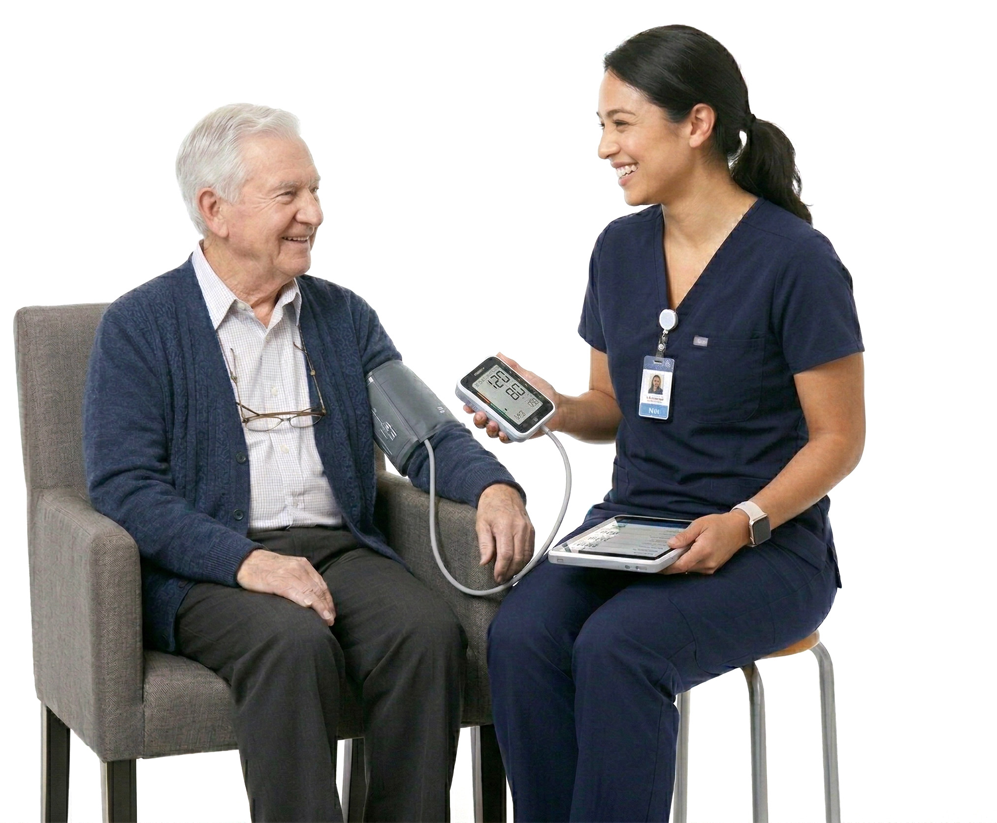 Healthcare provider taking a senior resident's blood pressure in a warm, professional setting